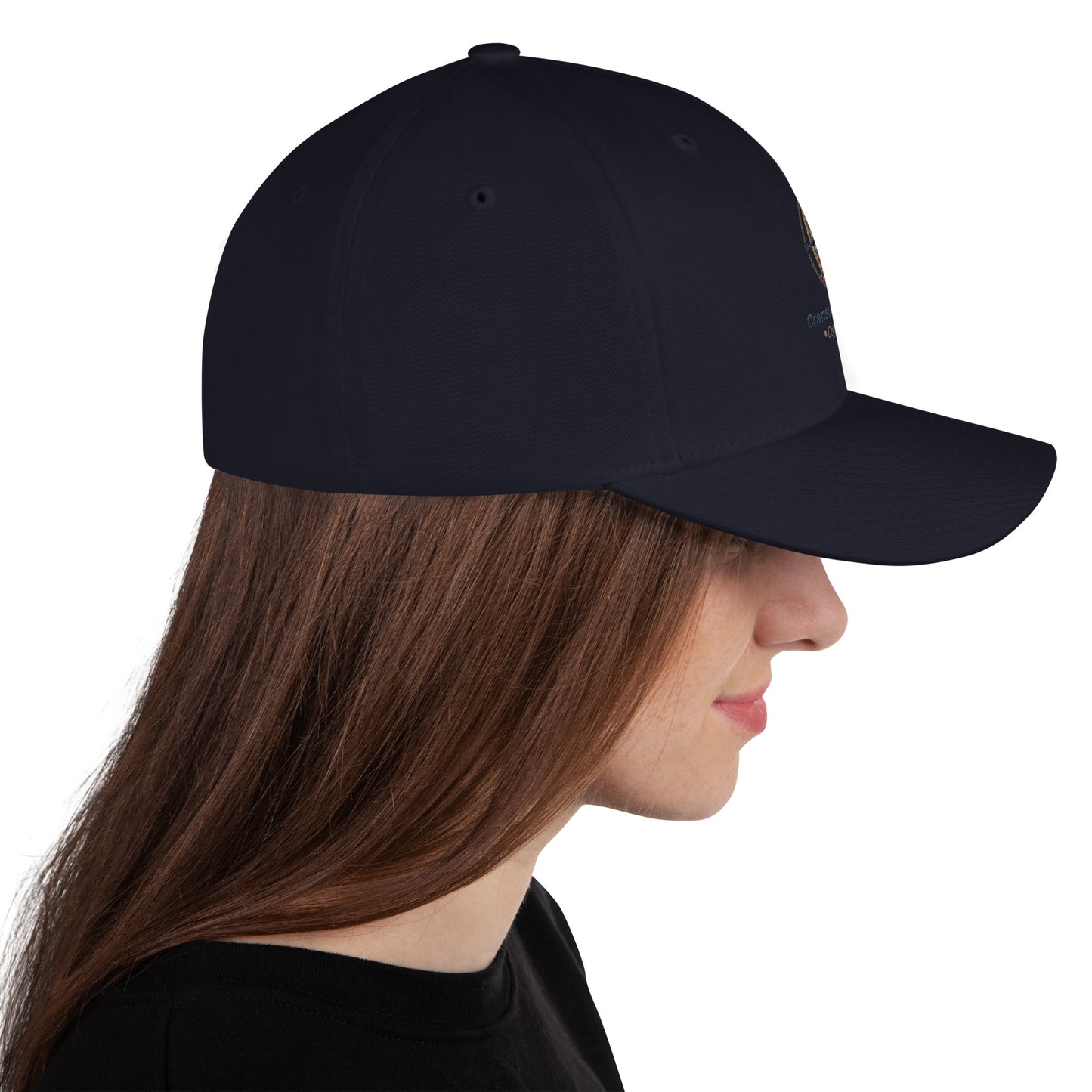 Structured twill cap in dark navy, angled side view with curved brim