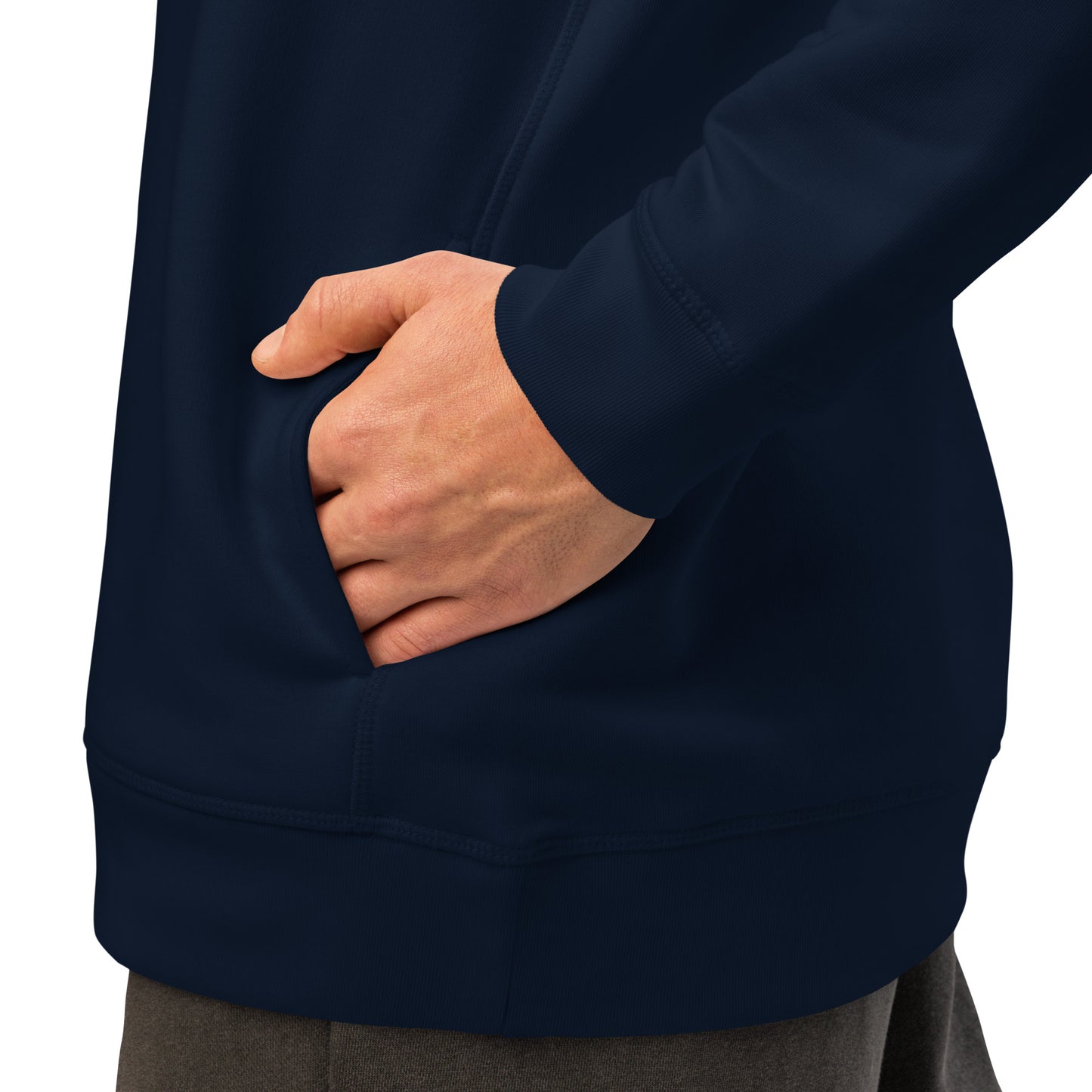 French navy hoodie side pocket area with hand resting near the front hem