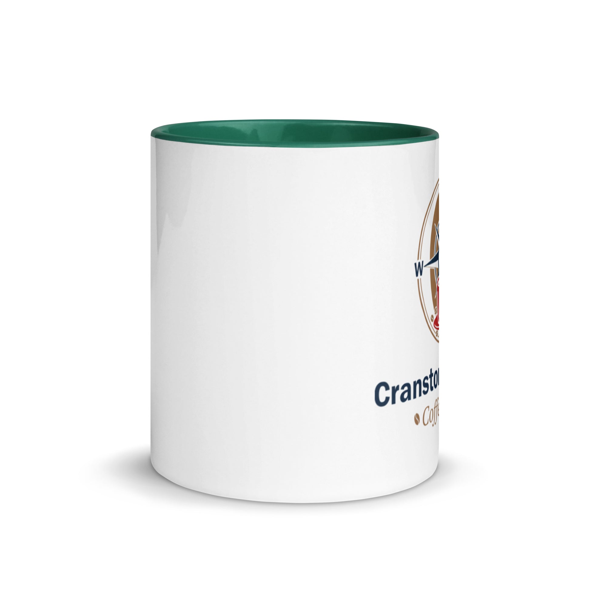 White ceramic mug with green interior rim and partial printed logo